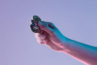 a person holding a cell phone in their hand