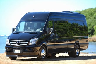 a black van parked on the beach