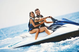 a man and woman riding a jetski in Tenerife