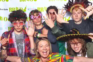 Group of young people pose for a photo in Get The Picture booth at awards ceremony party event