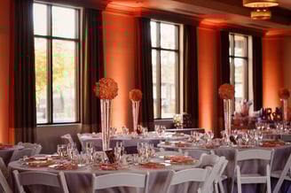 a table with a bunch of flowers and a vase with flowers