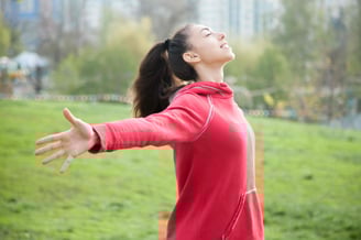 This image shows happy red hoodie girl with no headache.