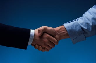 Visual of business handshake and growth roadmap