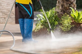Pressure washer doing pressure washing services