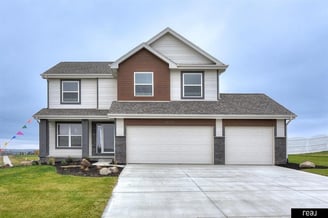 white and brown new construction home