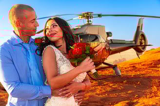 wedding couple by helicopter