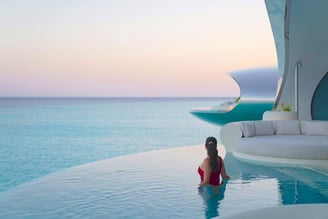 shebara-resort-overwater-villa-pool-sunset-model