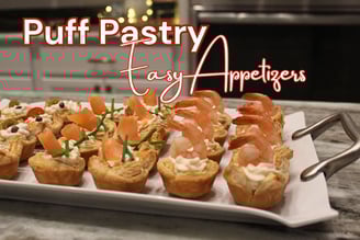 a platter of appetizing food with made with puff pastry and shrimp, chicken and smoke salmon