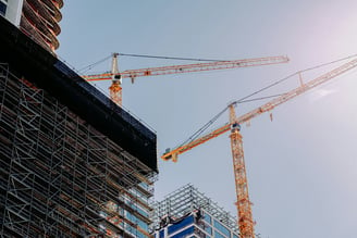 a crane is standing in front of a building