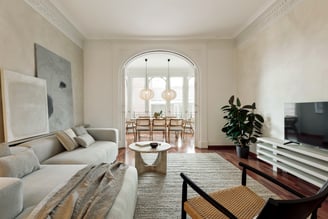 Sophisticated Living room with modern decor, natural materials, and a neutral color palette and art
