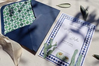 layout of dark blue envelope with custom liner and coordinated wedding invitation