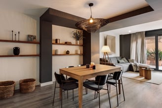 Stylish dining area with contemporary furniture, neutral tones, and a cozy interior design by SAVIA
