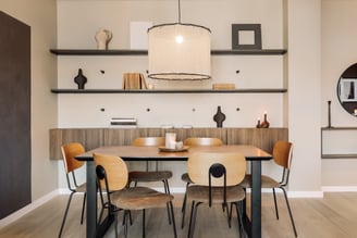 Contemporary dining area with bold color accents and clean lines design by SAVIA