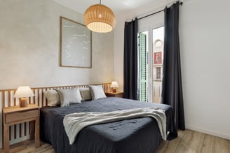 Elegant bedroom with natural textures, custom headboard, and calming color palette interior design