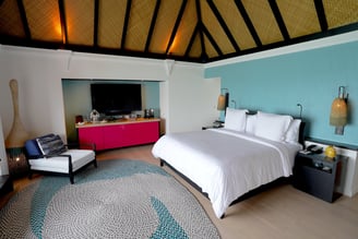 four-seaons-kuda-huraa-overwater-villa-bedroom-1