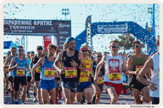 Runners participating in the Crete Half Marathon, moving with determination along the route