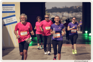 Runners participating in the Crete Half Marathon, moving with determination along the route