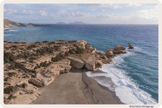 View of Triopetra Beach, Crete, Greece, showcasing its stunning rock formations and serene coastline