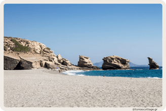 riopetra Beach, Crete, Greece, featuring its iconic three rocks and sandy shoreline