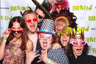 Group of young people pose for a photo in the Get The Picture booth at awards party event