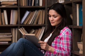 women reading a book