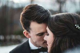 a man and woman in a tuxedo suit and bow tie