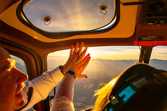 a man and woman in a helicopter