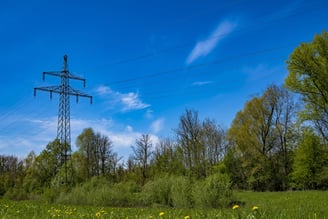 power lines in grassy field