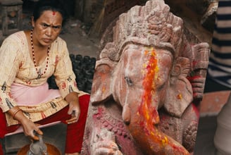 a woman is sitting working on pottery