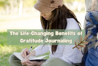 a woman sitting on the ground writing in her journal with a backpack and writing on it