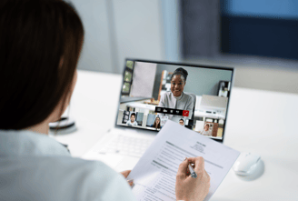 a business owner is in a meeting with her virtual finance team