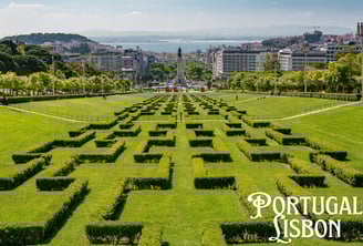 a large maze maze in a park with a view of the city Lisbon,Portugal