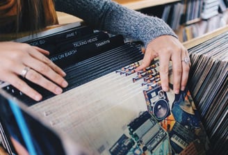 Someone browsing through vinyl records
