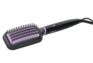 a hair brush with a purple and black brush