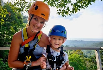 a woman and a child on a zipline hawk adventure koh samui zipline