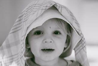 Children playing and laughing during a natural photo shoot in Essex.