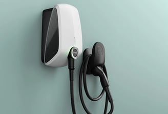 a white electric charger with a charging cord attached to it