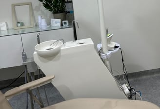 a dental room with a chair and a chair