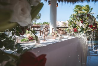 a table with a vase filled with flowers