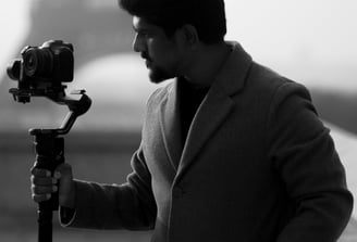Videographer from Recits by Jegath filming with a gimbal, showcasing cinematic wedding