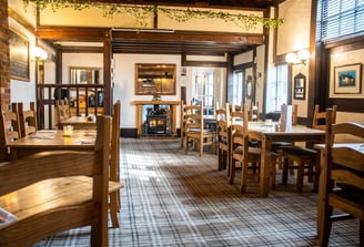 a pub restaurant with a fireplace