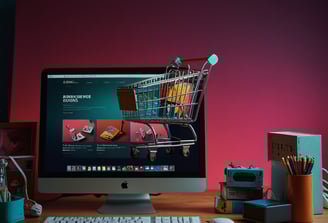 a computer monitor screen with a shopping carton