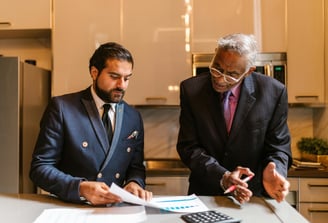 Two men are talking business in kitchen