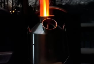 a rocket stove device to aid in cooking and boiling water