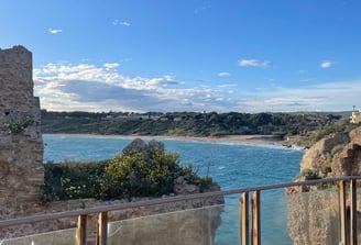 a balcony with a balcony and a view of the ocean