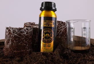 Nordic Rooter showing white roots and a beaker.