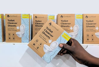 picking a box of ecomend toilet cleaner sheets from a shop