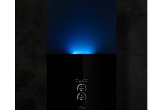 a blue light shining on a black background