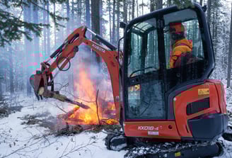 Using mini excavator to burn firesmart treatment debris in kananaskis AB