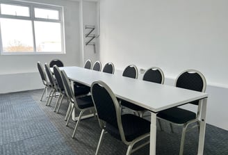 meeting room table with chairs in meeting room at DBC